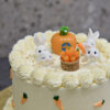bunny rabbit toy toppers on carrot theme cake